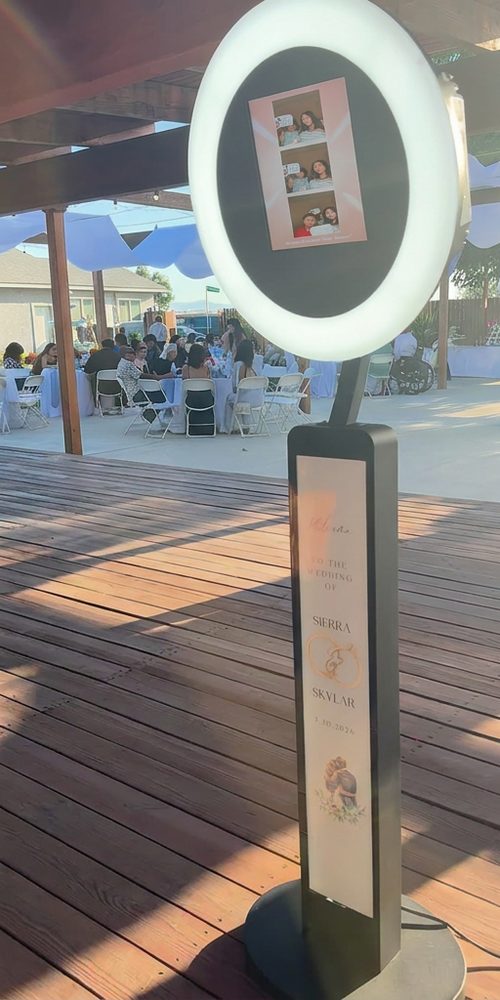Photo booth set up at an outdoor wedding reception
